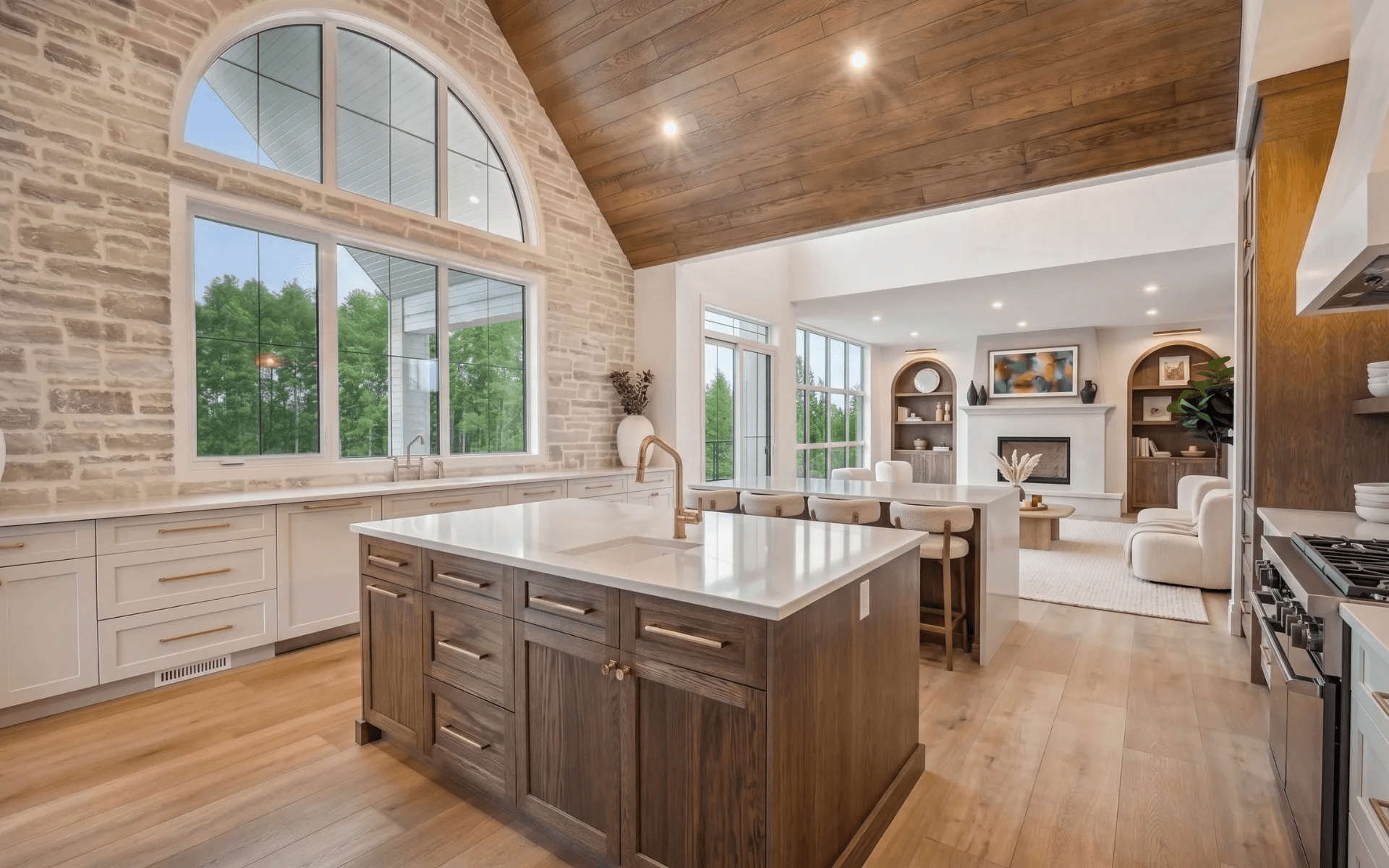 HRD Homes kitchen showing custom cabinetry, stonework and wood ceiling craftsmanship